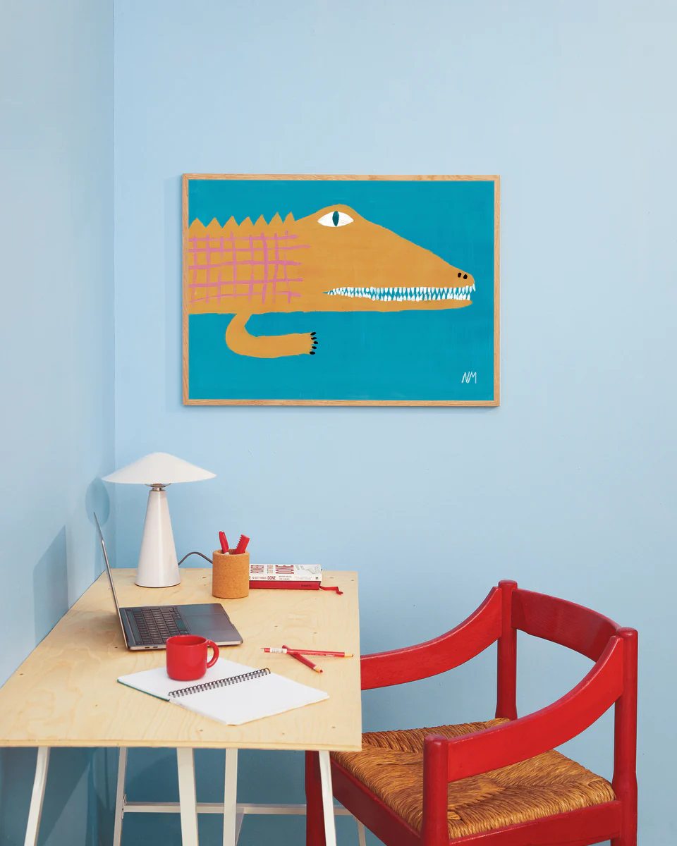 interior image of the "The Yellow Crocodile Poster" hanging on a blue wall in a vibrant bedroom