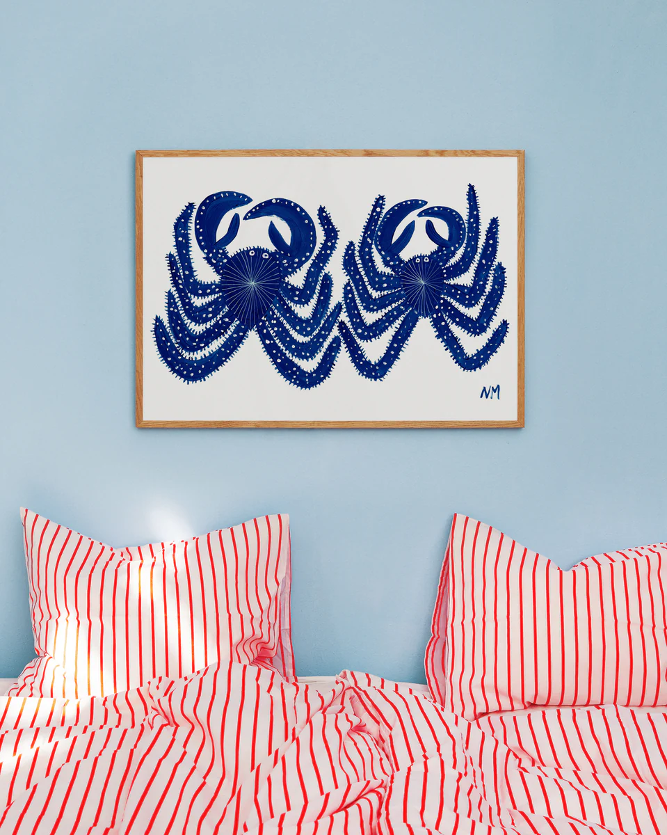 Environmental image of the poster on a blue wall in a colourful bedroom