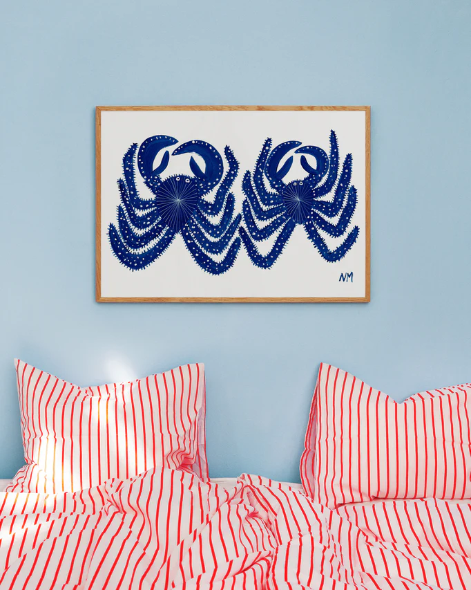 Environmental image of the poster on a blue wall in a colourful bedroom