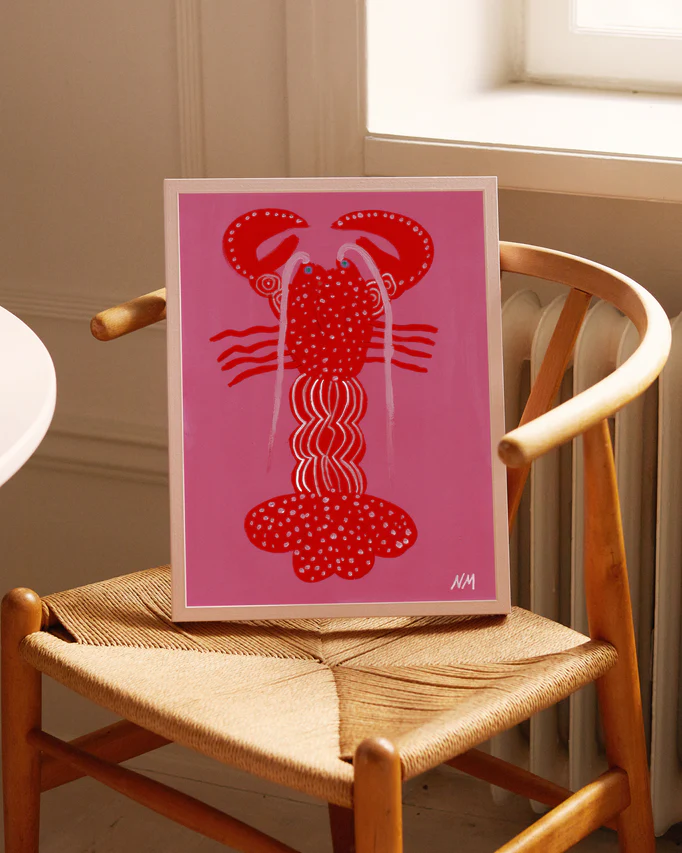 interior image of "Lobster in Pink Dreams Poster" on a chair in a kitchen