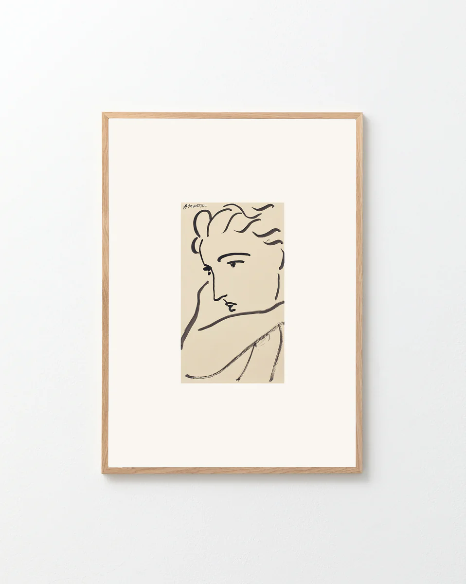 Framed line drawing of a woman's face on a white background
