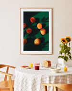 Poster framed in oak above a breakfast table