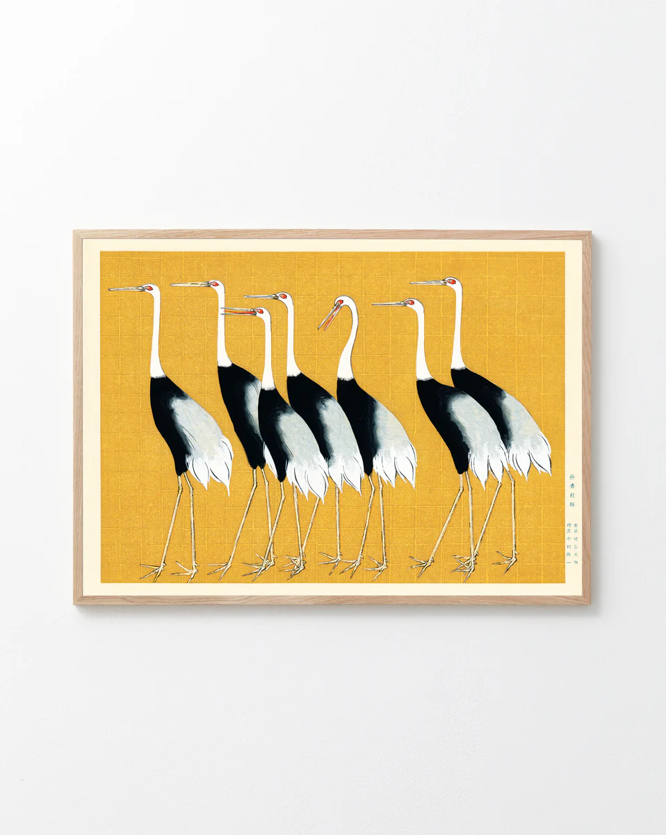 The Japanese Red Crown Cranes by Ogata Korin poster features six elegant birds in Japanese style, standing left against a textured yellow background. These cranes with black, white, and red markings are framed in light wood, creating a stunning wall decoration.