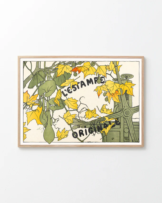 Framed artwork with a design of a bicycle and leaves on a white background