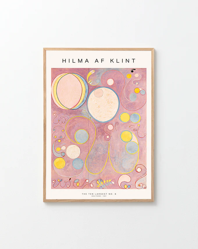 Framed abstract artwork with geometric shapes on a pink background, featuring the artist's name 'Hilma af Klint'.