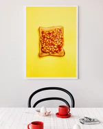 Poster "Baked Bean" in a white frame above a breakfast table