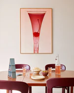 Poster "Cherry" in oak frame above a dining table decorate with snacks