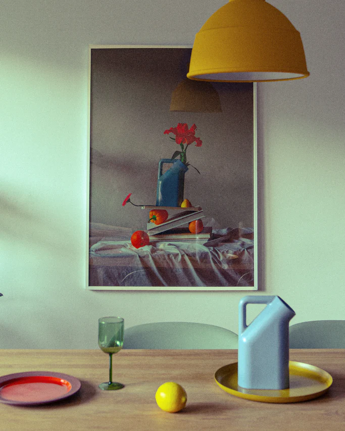 In a Berlin dining room, vibrant colors highlight a winter setting with a wooden table holding a green wine glass, blue pitcher, red plate, and yellow lemon. Above is a yellow pendant light and the Hanging in There Poster features flowers and fruit for added warmth.