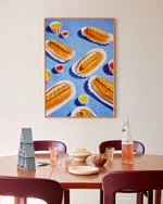Poster "Hot Dogs" above a dining table decorated with snacks
