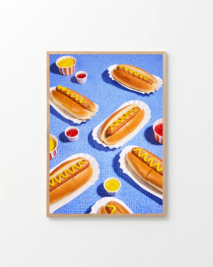 Poster "Hot Dogs" in a oak frame against a white background