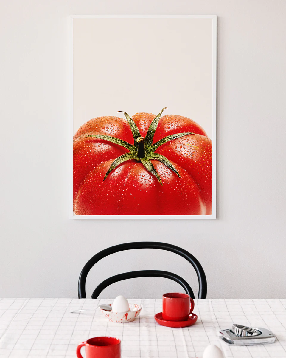 Poster "Tomato Close Up" in a white frame above a breakfast table