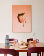 Poster "Strawberry White" above a dining table decorated with snacks