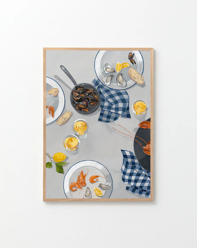 The Break Out of the Shell I Poster is a framed painting, ideal as a Wallbaby poster, showcasing a table with seafood dishes: mussels in a pan, oysters on a plate, and prawns. Lemon slices and bread rest on a blue checkered cloth against a light background.