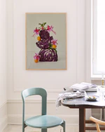 Poster featuring a still life composition of red cabbages balanced on top of each other, adorned with pink flowers, set against a white background in oak frame hanging in a kitchen