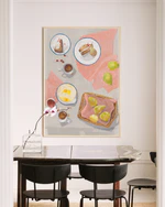 A dinner table with a big poster framed in oak