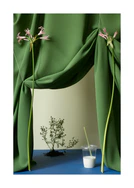 Still life photograph of green curtains, pink flowers and a glass of milk.
