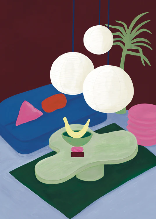 The Colourful Living 01 Poster features a modern room with stylish furniture: a green abstract table with a yellow banana sculpture, a red cube, three large white lanterns above, and a blue couch with pink cushions alongside a potted plant against the dark wall.