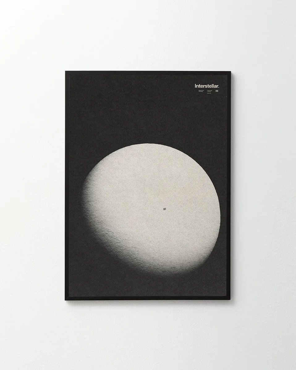 A black canvas with an almost full moon next to the word interstellar.