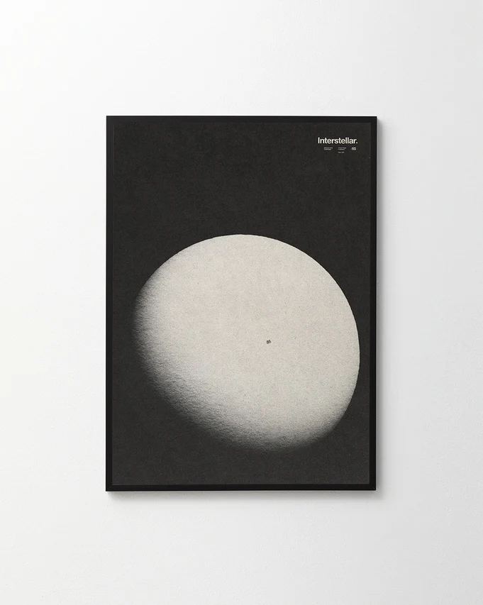 A black canvas with an almost full moon next to the word interstellar.