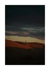 Man walking alone over orange hills in a beautiful landscape under a stormy sky.