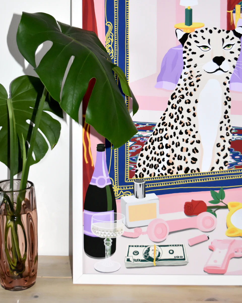 The Bonafyde Poster showcases a framed masterpiece featuring a leopard with a leafy plant. A champagne bottle, glass, dollar bill, lipstick, roses, and hand mirror adorn the table in front of the artwork.