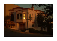 Suburban house laying at an intersection photographed during sunset.