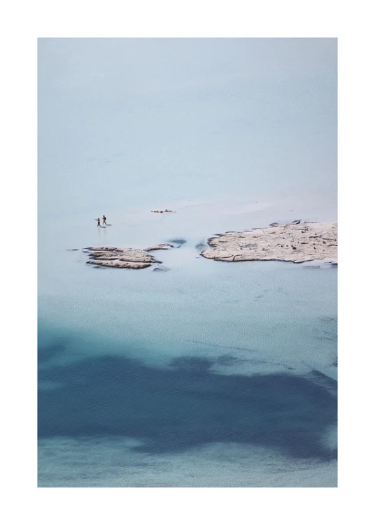 Shallow white and blue waters mirroring the sky up above.