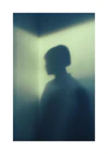 Shadow of a woman with short hair in the corner of a room with white walls.